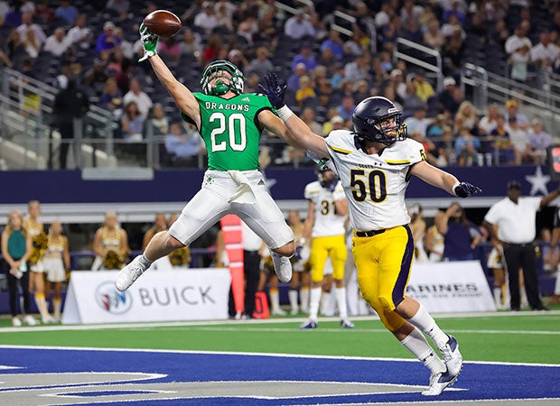 Southlake Carroll (Texas) running back James Lehman makes a spectacular one-handed touchdown catch over a Highland Park defender at AT&T Stadium in August.