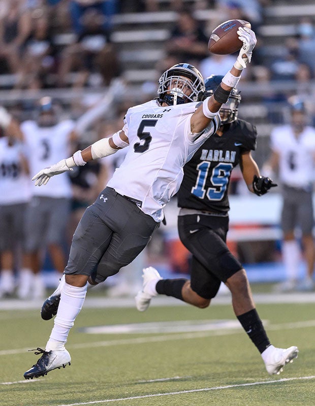 Clark (Texas) cornerback Ethan Rayfield makes a leaping, one-handed interception against Harlan in August.  