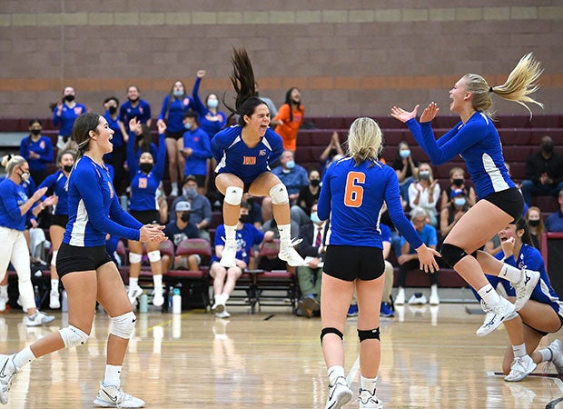 Bishop Gorman (Nevada) junior varsity volleyball players celebrate during a match at host Faith Lutheran in September.