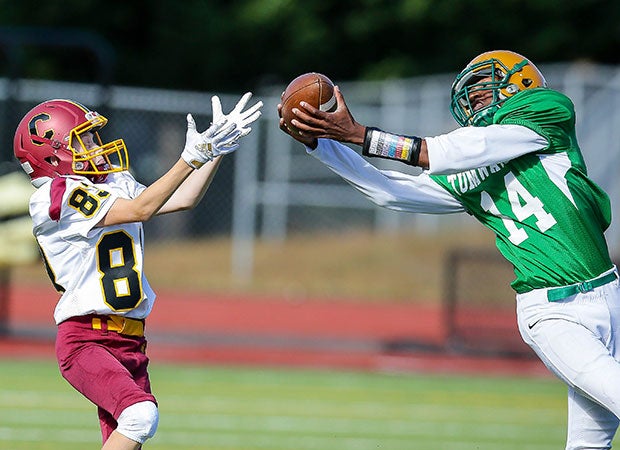 A Tumwater (Wash.) defender swoops in for an interception in front of a Capital receiver during a junior varsity game in September.