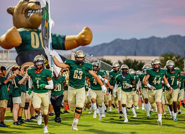 Basha (Ariz.) players storm the field before their season-opener against visiting O'Connor in September.