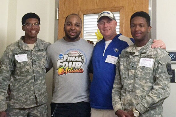 Imoter Mngerem and coach Kelly Davis are flanked by two of Mngerem's best friends and former football teammates, Moleik Campbell and Mahlik Faulk.