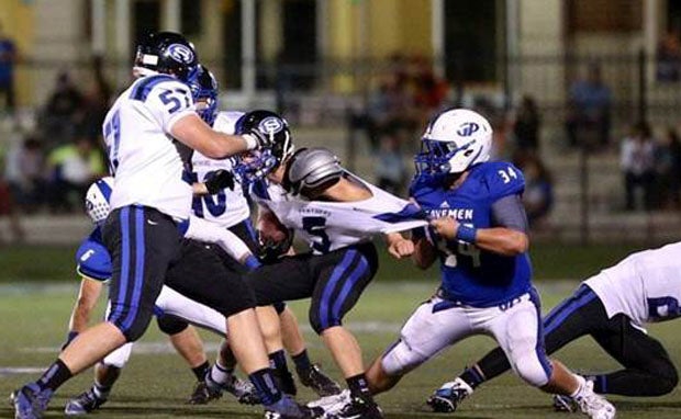 Brendan Sharp (34) is just part of the stout Grants Pass defense.