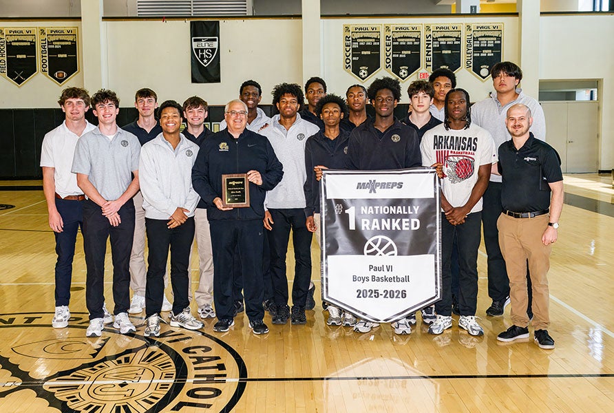 Paul VI celebrates with the MaxPreps National Championship banner Monday. The Panthers finished No. 1 for the second time in three seasons. (PHOTO: David Custer)