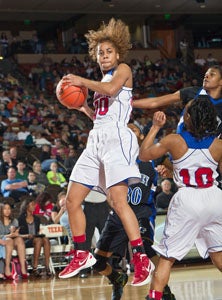 Duncanville's Kiara Perry snaps 
up a rebound. 
