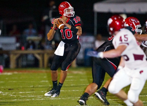 North Gwinnett QB C.J. Uzomah looks downfield during the Bulldogs' 14-11 win over Prattville on Saturday.