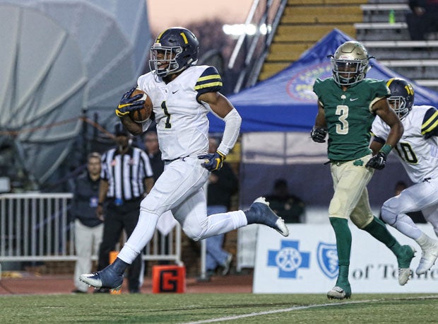 Eric Gray is the most prolific single-season touchdown maker in state history. Now's he's trying to break records in raising money for pediatric cancer.