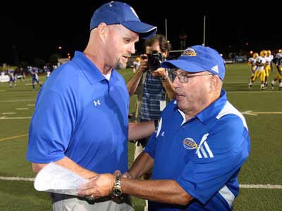 Coaches Richardson (left) and Alberghini greet after the game.