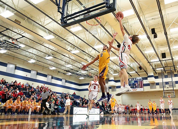 Pottsboro's (Texas) Ross Hendrix soars to the basket for a layup against Edgewood in the UIL 2A Area playoff game.