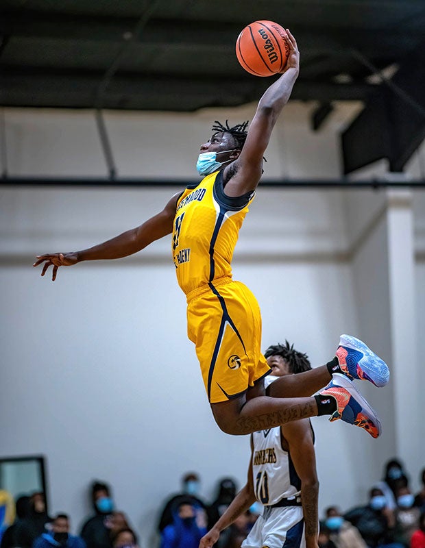 Guard JaQuantae Harris of Northwood Temple Academy (N.C.) soars for a dunk against host New Life Christian Academy. 