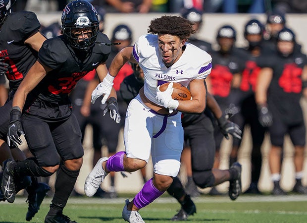 Timber Creek's (Texas) Jalen Harris continues to battle despite having his helmet ripped off during a UIL 6A Division 1 Bi-District playoff game against Euless Trinity.