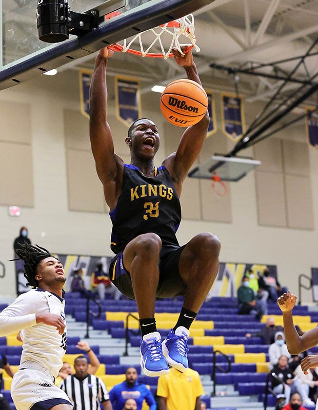 Center Deiman Reyes of Victory Christian Center (N.C.) finishes a two-handed dunk against South Cobb in the Tournament of Champions in Atlanta.  