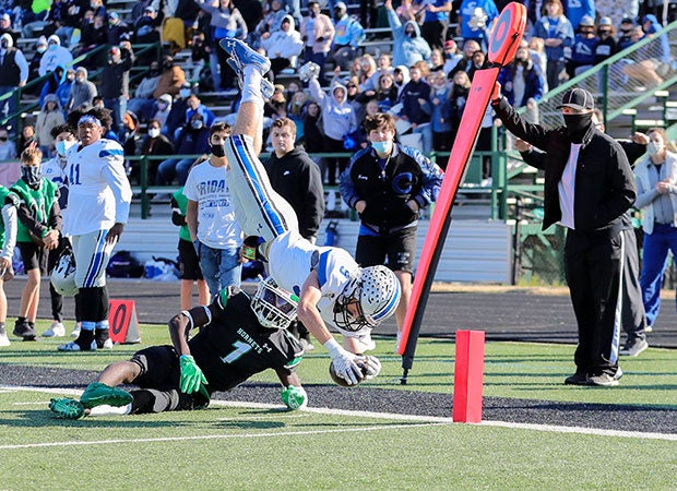 Kendall Earheart of Centennial (Texas) leaps to reach the end zone against Azle in a UIL 5A Division 1 Bi-District playoff game. 