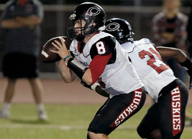 Centennial quarterback Anthony Catalano looks to pass.