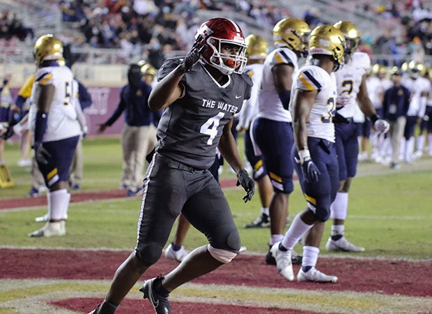 Edgewater running back Cedric Baxter celebrates his first-half touchdown run.