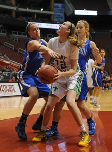 St. Mary's sophomore Courtney
Ekmark battles inside.