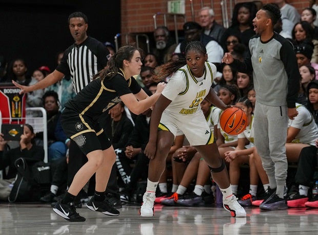 Archbishop Mitty's Emma Cook guards Ontario Christian freshman Tati Griffin. No. 2 Ontario Christian beat No. 1 Mitty 61-44 in a rematch of a game two weeks ago in the Nike TOC final. (Photo: Ernie Abrea)