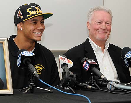 D.J. Foster enjoys the moment with his coach John Sanders.