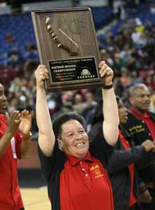 Coach Cheryl Draper holds up
Berkeley's 10th NorCal title.  