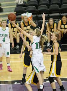 Kendall Kenyon goes after one of
her game-high 20 rebounds.