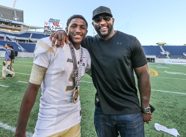 Rayshad, left, and father Ray Lewis celebrate after Bishop Moore's Florida state title.