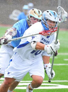 Darien junior Tony Britton (10)
is being harrassed by Henry Blynn.