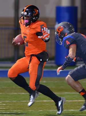 Treon Harris avoids Bishop Gorman's Nicco Fertitta.