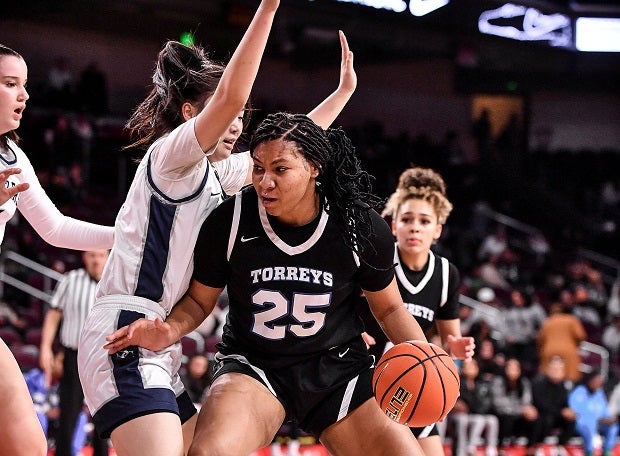 La Jolla Country Day's Breya Cunningham backs down in the paint against Sierra Canyon's Crystal Wang on Saturday. Sierra Canyon won 64-55 in what might be a precursor to the CIF Southern California Open Division finals. (Photo: Louis Lopez)