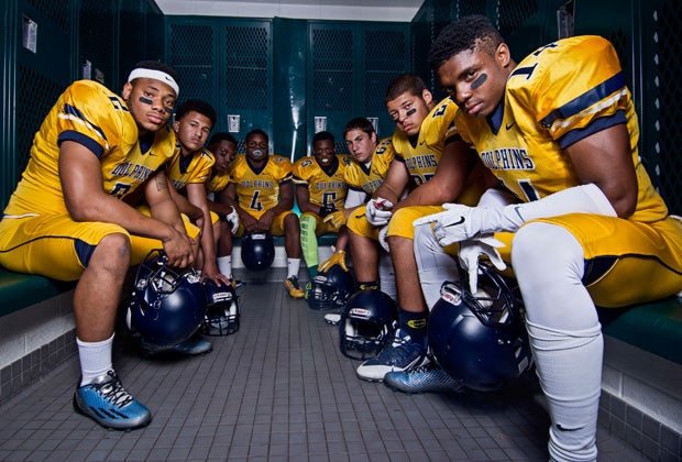 The players pose for a group shot in the team's locker room.