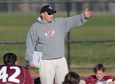 Garden City coach Steve Finnell and the Trojans face Manhasset Saturday.