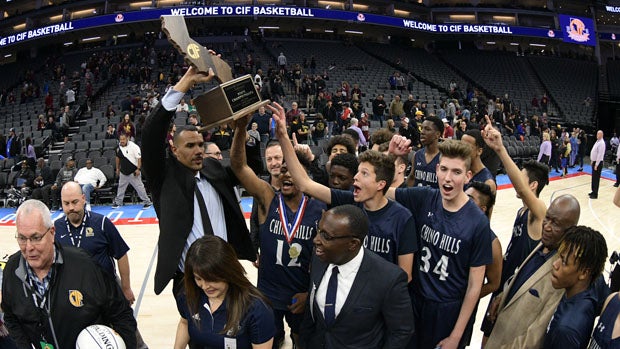 Coach Dennis Latimore and Huskies celebrate state Division 1 title. 