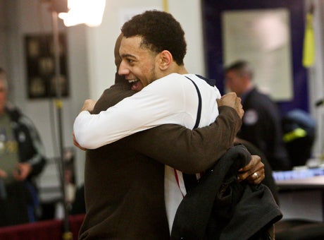 Nigel Williams-Goss embraces his dad Virgil Williams after making the game-winning shot.