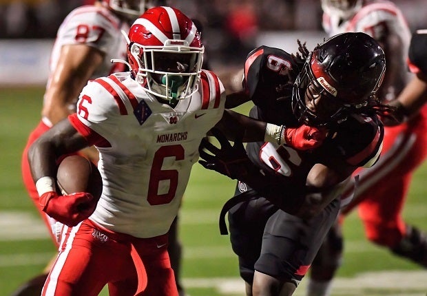 Mater Dei's Nate Frazier runs for some tough yards in the Monarchs' 43-20 win Friday over Corona Centennial. Frazier scored a second-quarter touchdown on a 13-yard run.