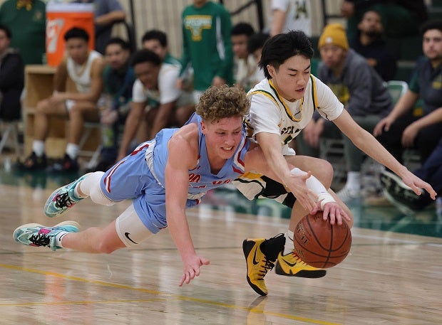 Senior Brady Carson dives to secure a loose ball during Hillsdale's 53-35 league win over Capuchino.(Photo: James Regan)