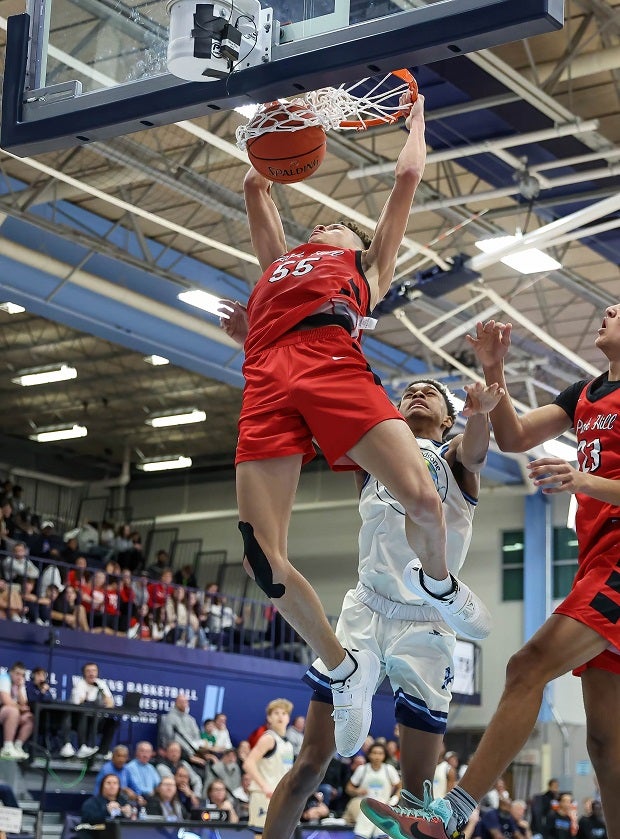 Park Hill's Marqueas Bell finishes a monster dunk on Oak Park.(Photo: David Smith)
