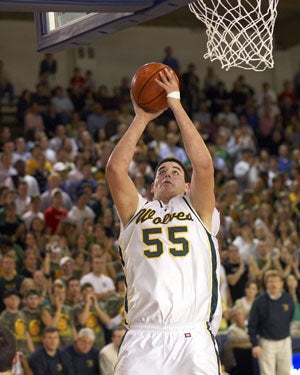 Omar Samhan during his senior year in 2005
with Raynor looking on.