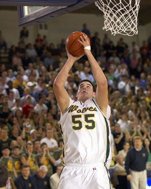 Omar Samhan during his senior year in 2005
with Raynor looking on. 