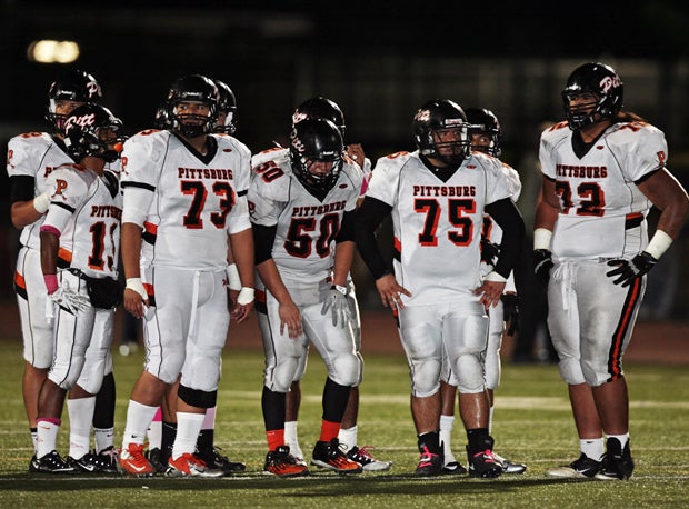 Pittsburg's stout defensive line waits for Freedom to break from the sideline. Pittsburg outgained Freedom 400-263.