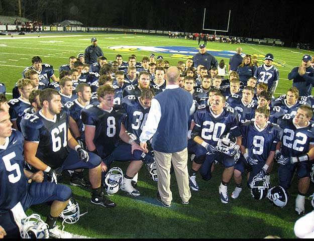 Coach Antonucci congratulates his players after the big win.  