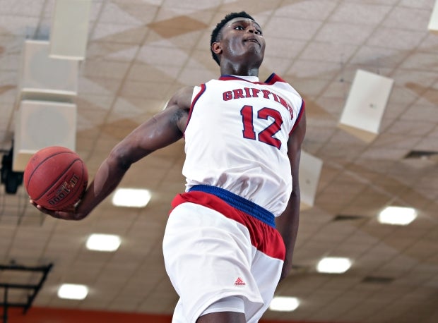 Zion Williamson rears back for a dunk at the Chick-fil-A Classic in December.