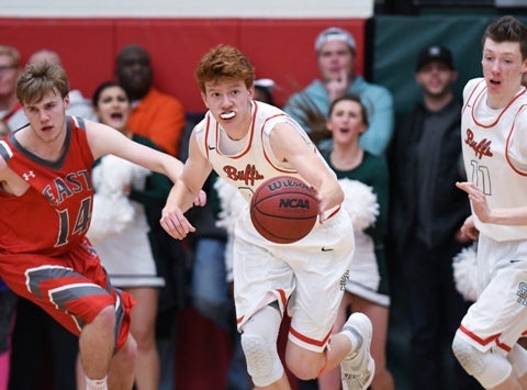 Junior Kenny Foster (center) is one of several key returnees for the Smoky Hill boys basketball team. The Buffaloes began the season ranked No. 2 in Class 5A.