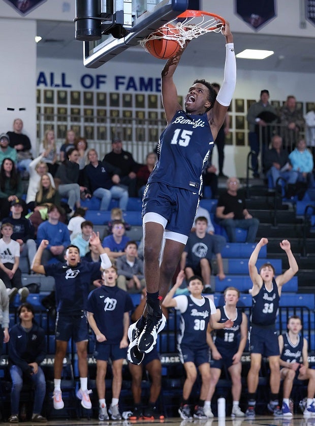 Bemidji senior Isaac Severts gets the bench hyped with his dunk during a game against Apollo. (Photo: Lainie Hiller)
