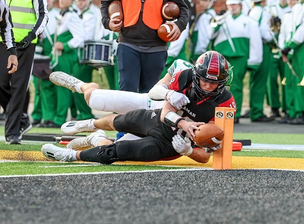 Lamar's Joel Beshore dives and scores a touchdown with a Blair Oaks player in tow during the MSHSAA Class 2 Championship. (Photo: David Smith)