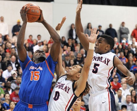 Findlay Prep's Nigel Williams-Goss and Dominic Artis defend the nation's No. 1 ranked senior, Shabazz Muhammad of Bishop Gorman. Muhammad entered the contest averaging over 30 points per game but was limited to 19 in Saturday's loss.