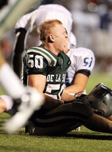 Both teams were exhausted after this
one, including De La Salle's Chris
Olinger (50).