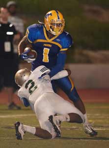 Shaq Thompson tries to break atackle Saturday in a tight loss toLong Beach Poly.