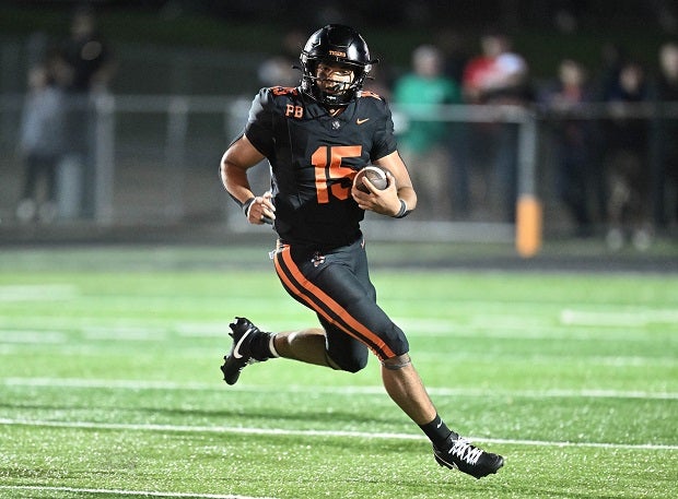 Massillon Washington quarterback DaOne Owens had a huge night on the ground in the Tigers' 15-13 win over St. Edward. He rushed for 176 yards and two scores as Massillon Washington enters the MaxPreps Top 25 at No. 20. (Photo: Jeff Harwell)