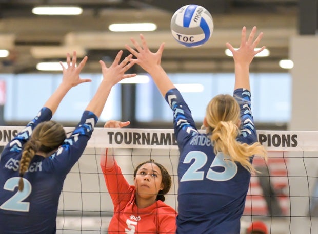 Syriana Messy splits the Marymount block looking for a kill. (PHOTO: Darin Sicurello)