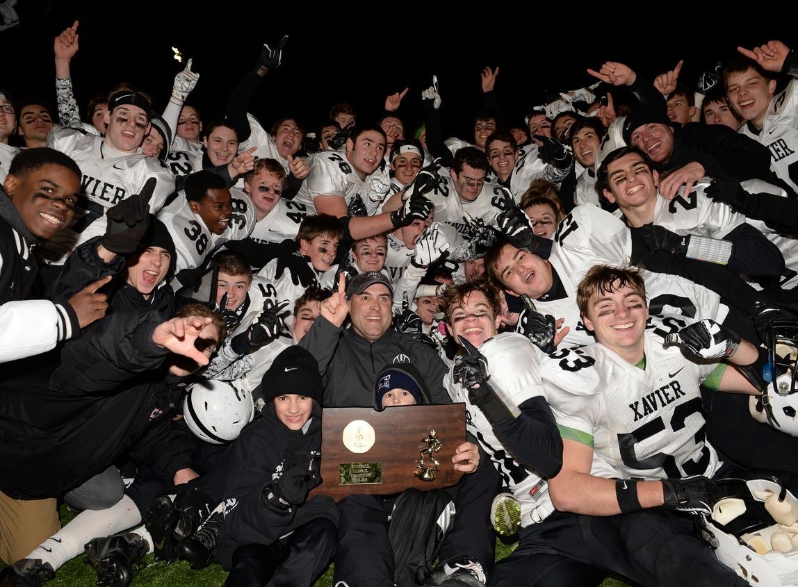 Xavier captured one of eight CIAC football tournament championships in 2014. The Connecticut playoff format for 2015 returns to the traditional four-division alignment. 