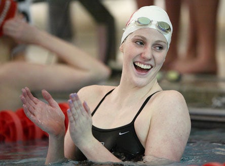 Franklin had plenty of reason to smile, as her team beat its rival in a tight dual meet.